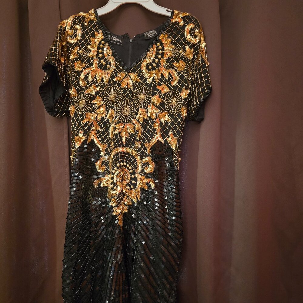 JEWEL QUEEN  SMALL BLACK DRESS WITH GOLD EMBELLISHMENTS